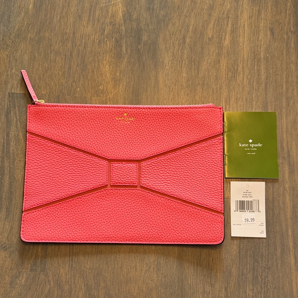 kate spade bridge place pebbled leather bow clutch in flamingo